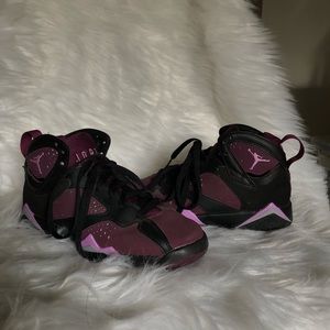 Purple and black Jordan 23’s